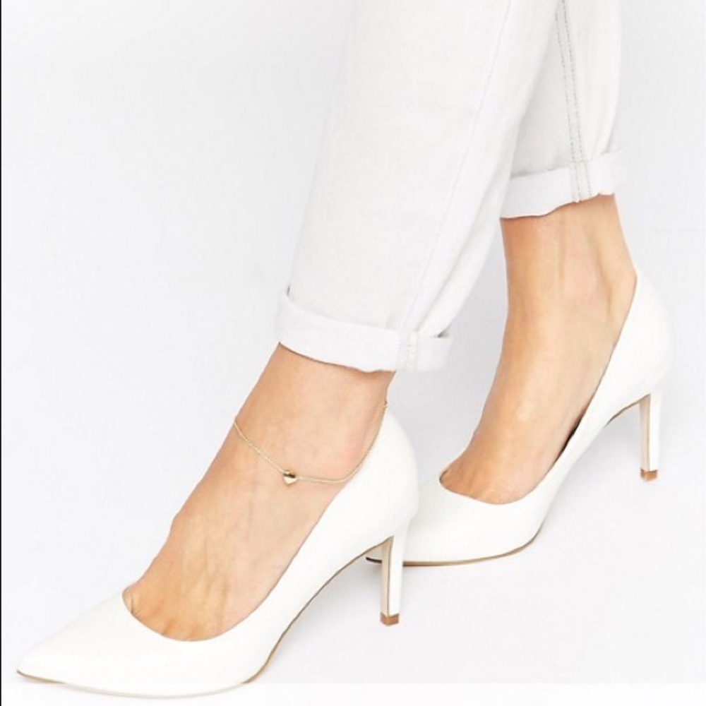 White pointed heels